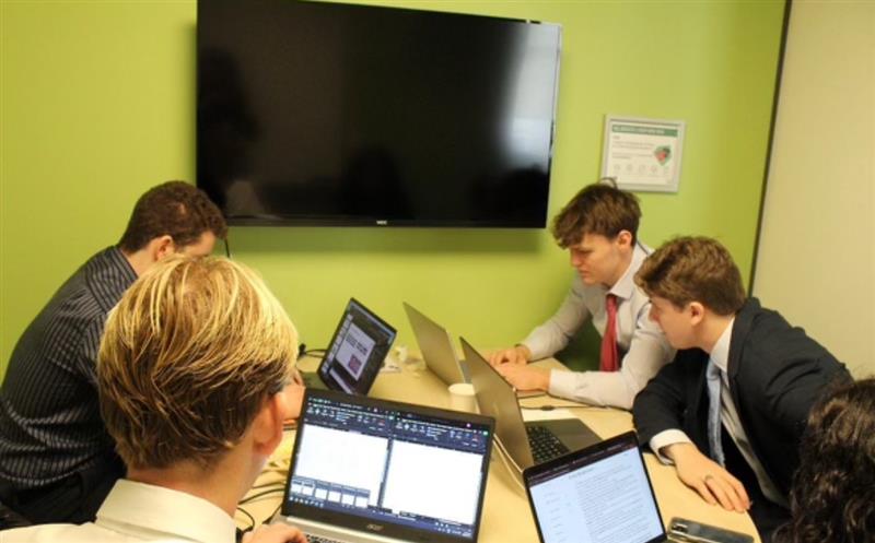 Group of students at a table working