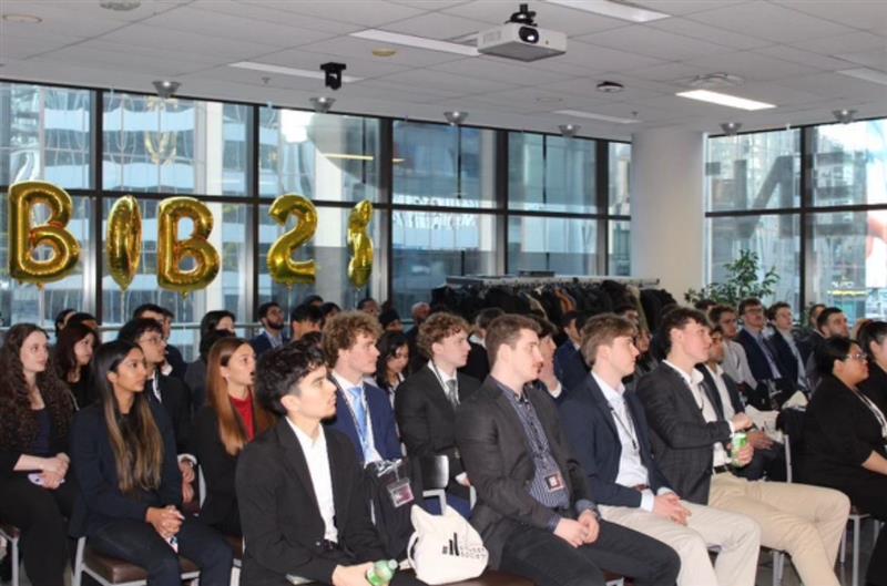 People listening to a speaker